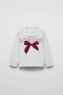 Niños ZARA 1½ - 6 Años·Camisetas|6 - 18 Meses·Camisetas<CAMISETA LAZO RIZO