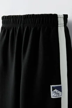 Niños ZARA 6 - 14 Años·Pantalones|6 - 14 Años·Deporte / Chándal<PANTALÓN BANDAS LATERALES