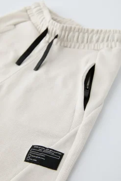 Niños ZARA 6 - 14 Años·Pantalones|6 - 14 Años·Deporte / Chándal<PANTALÓN FELPA CORTES