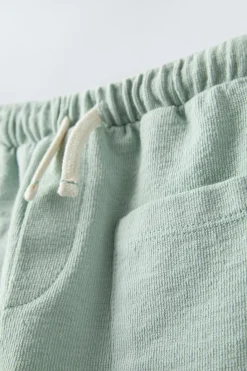 Niños ZARA 6 - 18 Meses·Pantalones / Leggings<PANTALÓN LISO BOLSILLOS