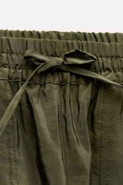 Sale PANTALÓN SATINADO BAJO PUÑO Mujer Pantalones