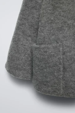 Niños ZARA 6 - 18 Meses·Abrigos / Buzos<TRENKA LANA CAPUCHA